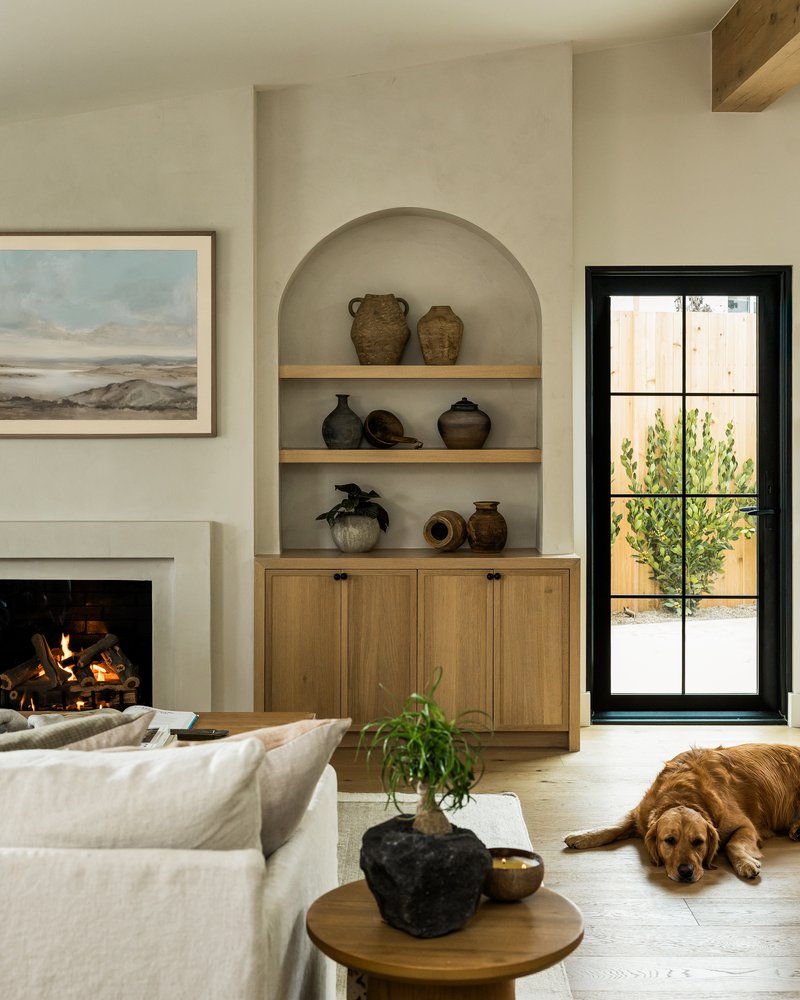 Living room bookshelf and fireplace in Rochell Retreat by Pure Salt