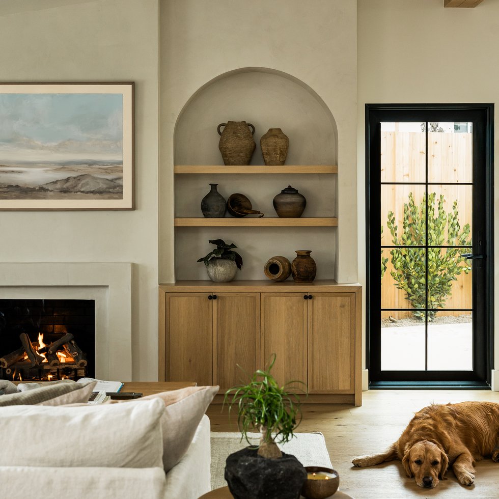 Living room bookshelf and fireplace in Rochell Retreat by Pure Salt