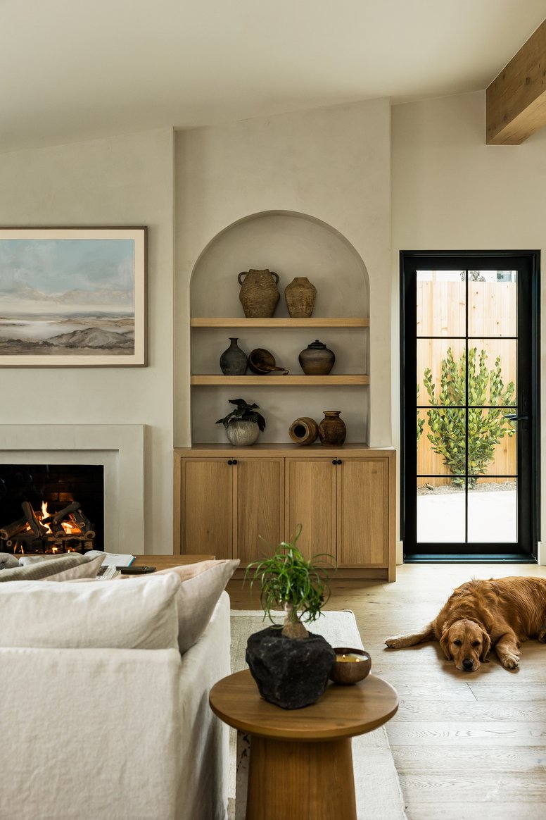 Living room bookshelf and fireplace in Rochell Retreat by Pure Salt