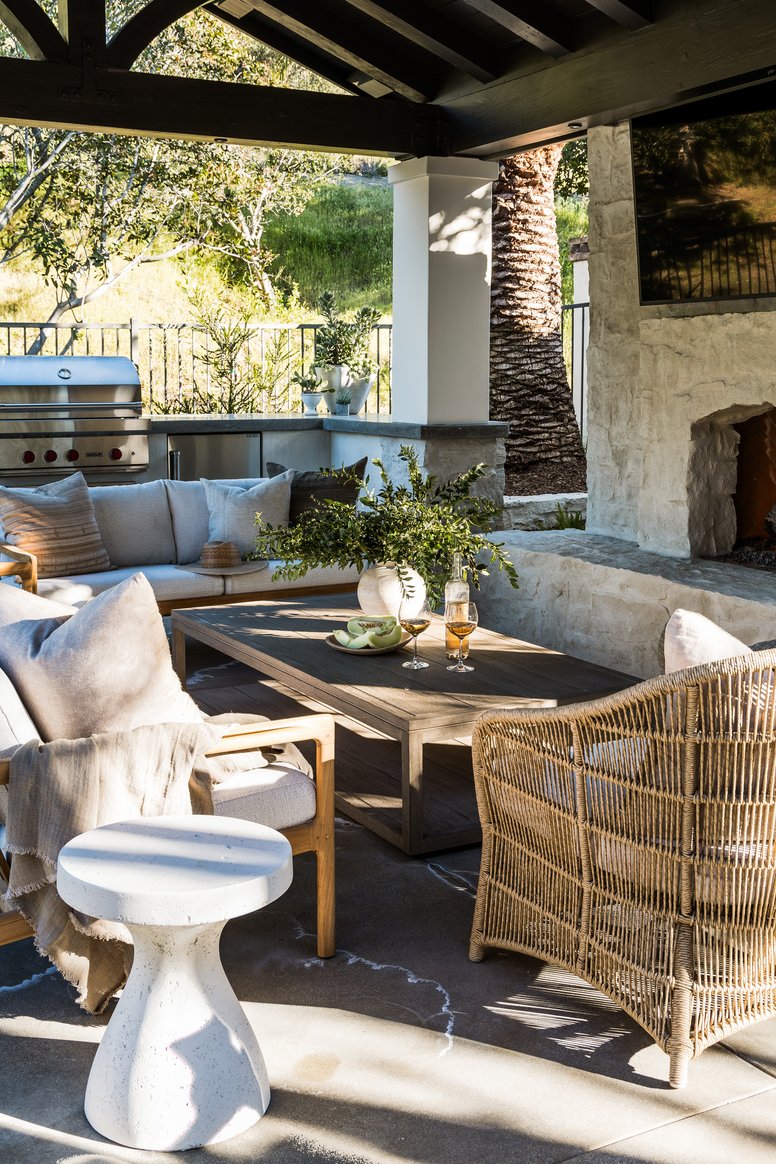 Outdoor living with fireplace in Shady Canyon by Pure Salt