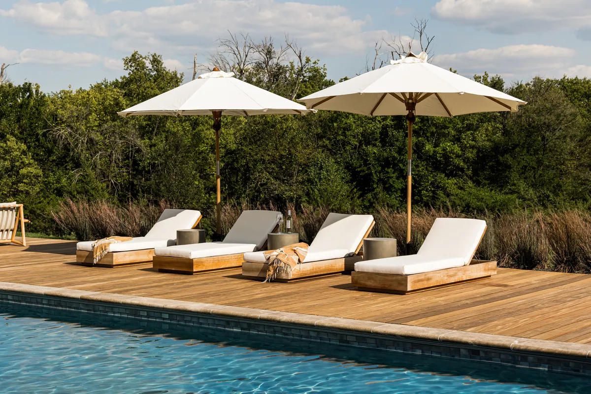 Outdoor seating by the pool in Flint Hills by Pure Salt