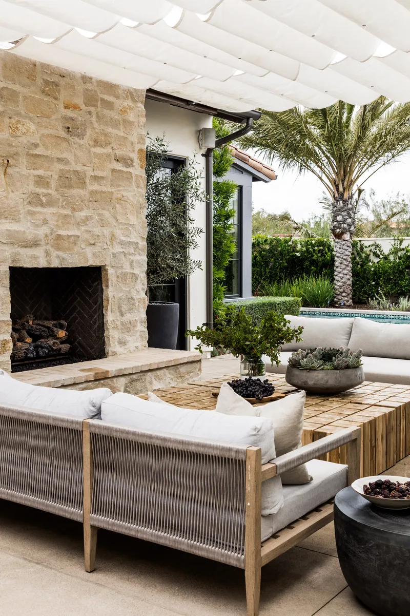 Outdoor seating with fireplace in Coastal Canyone by Pure Salt