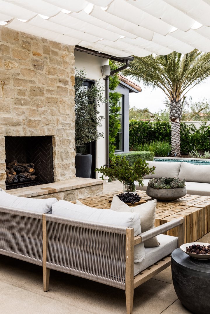 Outdoor seating with fireplace in Coastal Canyone by Pure Salt
