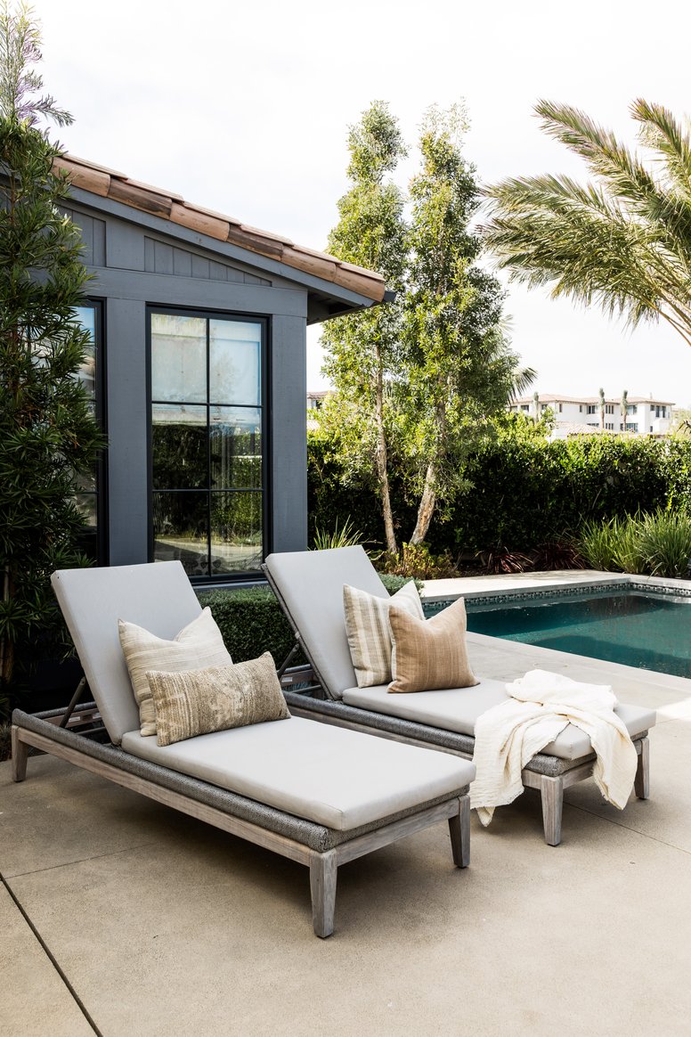Outdoor lounge seating poolside in Coastal Canyon