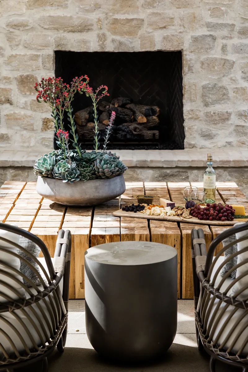 Outdoor living with fireplace in Coastal Canyon
