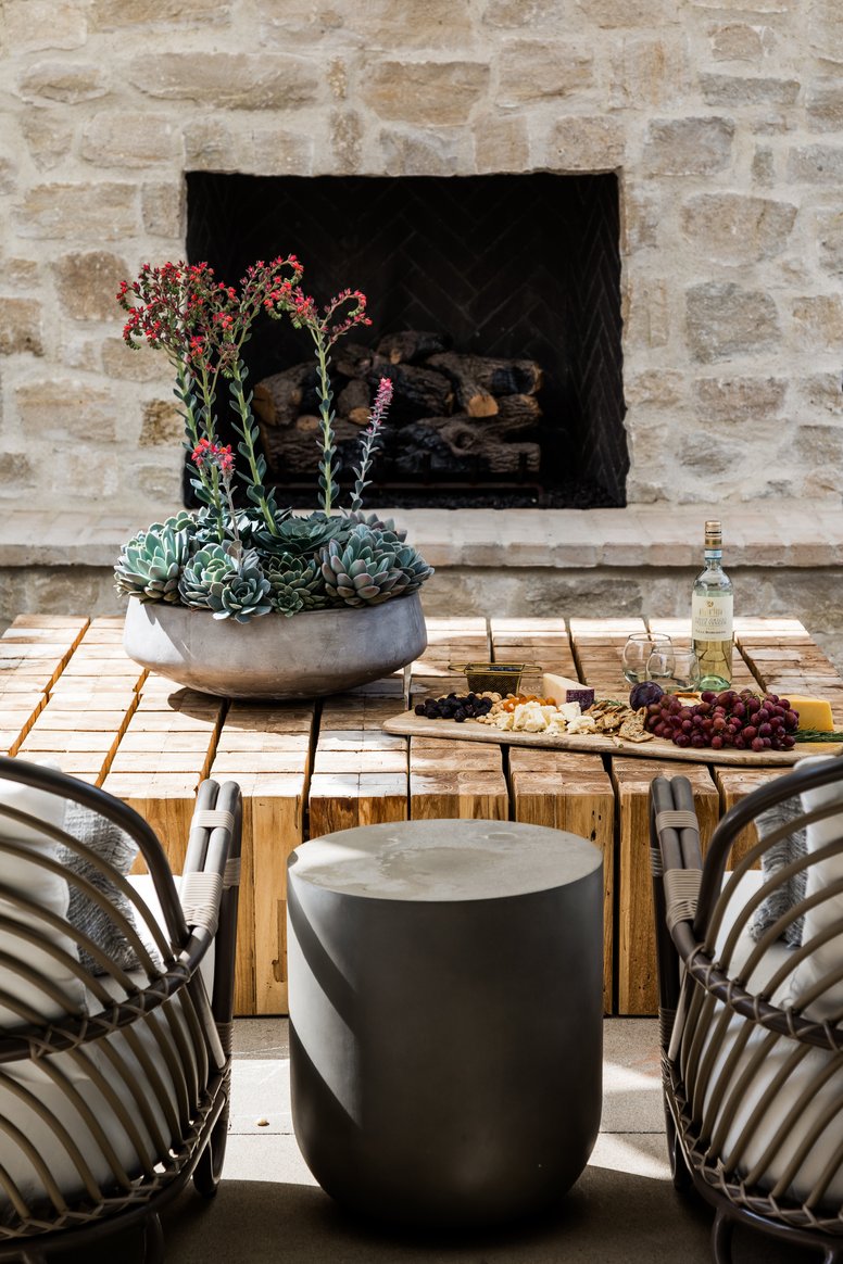 Outdoor living with fireplace in Coastal Canyon